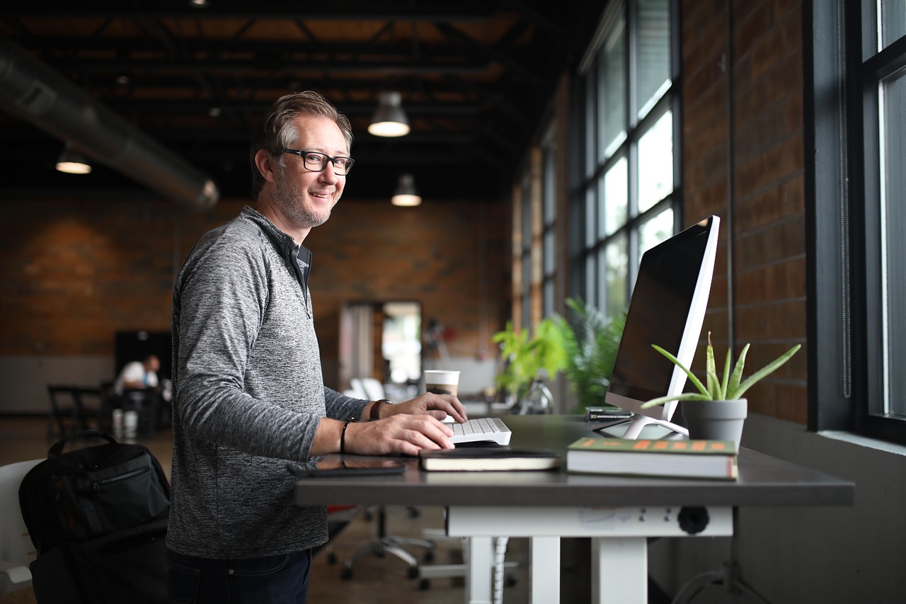 Office desk, man, business — The Influence of Celebrity Endorsements on Dogecoin Value