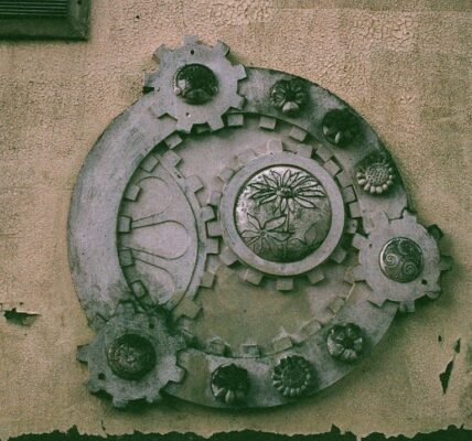 Decorative gear design on a textured wall