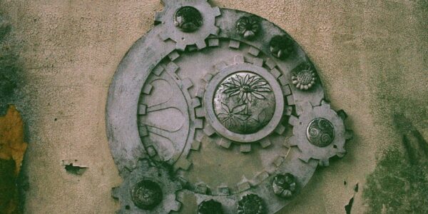 Decorative gear design on a textured wall