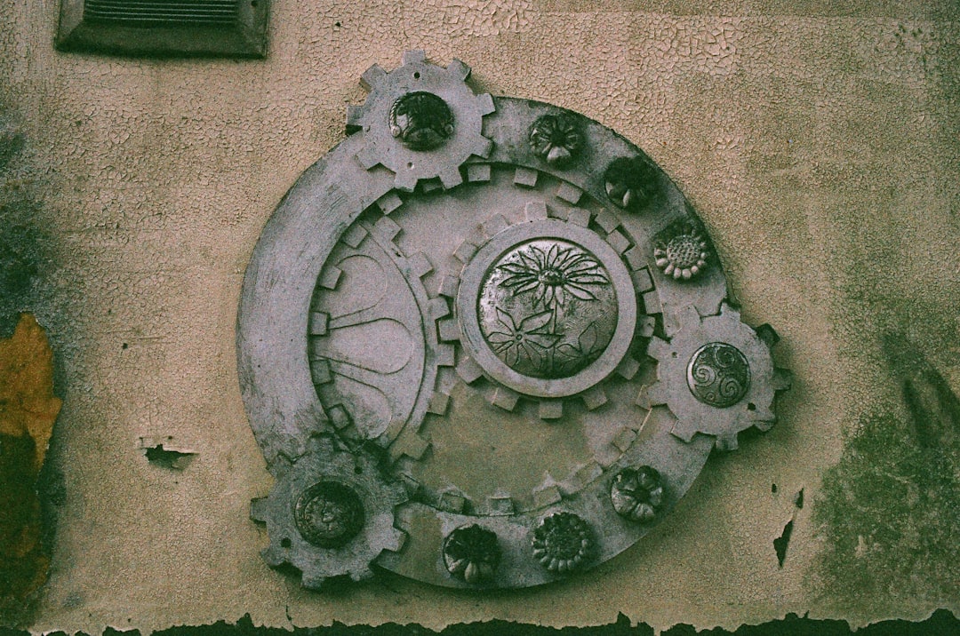 Decorative gear design on a textured wall